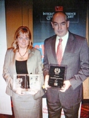Caroline Slim with her award from QinetiQ