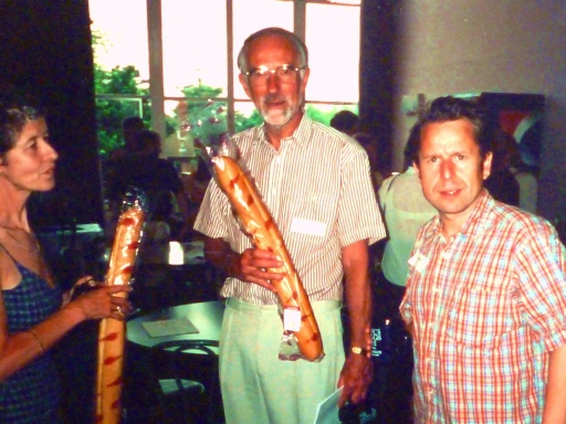 John McLaughlin posing with a baguette
